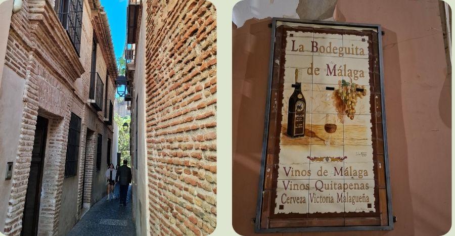 Sfeerbeeld van een smalle historische straat in Málaga en een traditioneel betegeld uithangbord van La Bodeguita de Málaga.